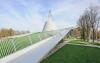 Pitched green roof with lawn and railing